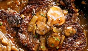 Ribeye steak with onion gravy, mushrooms & fresh greens. Ribeye Steaks With Mushroom Gravy Easy Recipes