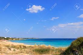 You can reach taranto by plane with ryanair. Italien Sommer Seelandschaft Apulien Kuste Marina Di Lizzano Strand Taranto In Den Vordergrunddunen Mit Uppigem Mediterranem Peeling Die Kustenlinie Zeichnet Sich Durch Einen Suggestiven Wechsel Von Sandigen Buchten Und Gezackten Klippen Aus