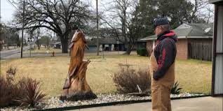 Alba man has 5-foot-tall bass carved out of tree stump