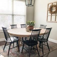 It's crafted with a distressed top and eased edges, and designed to maximize legroom and serving space. Toscana Round Extending Dining Table Round Wood Dining Table Dining Table Round Dinner Table