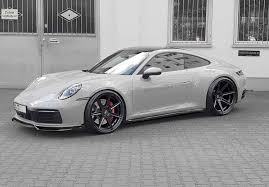 We get a larger carbon fiber rear diffuser, extra air vents in the bumper, a modified apron, and a new carbon rear spoiler. Pin By Zucchero Sibanyoni On Moshammer Porsche Porsche Sports Car Porsche 911