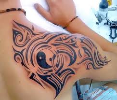 It is also one of the sexiest places to get a shoulder tattoo. Tribal Men Shoulder Blade Tattoo Idea