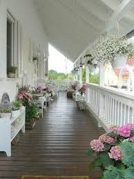 Wraparound Porch With Pots Planted In A Pink White And Green Color Scheme Is Lovely Uploa Summer Porch Decor Front Porch Decorating Farmhouse Front Porches