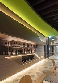 Interior Lighting Design Ideas A Wall Of Hidden Led Lights Behind Wood Panels Creates A Warm Modern Glow Lighting Design Interior Interior Design Dubai Interior Lighting