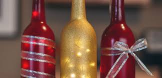 I added a pull on each end, filled it with 7 empty wine bottles and dropped a pretty flower in each one Diy Wine Bottle Centerpieces For Your Holiday Table Chateau Grand Traverse