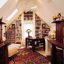 This office has a unique jungle theme where the use of the plants helps to bring the small space to life… the bright & colorful accessories help to give the room a creative, relaxed and homely feel… Attic Library Home Library Design Small Home Libraries Small Home Library