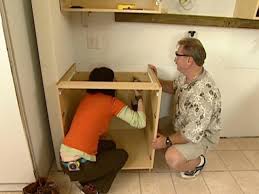 Sinks are designed to fit in regular kitchen cabinets which have a side maybe 20mm thick. How To Install Wall And Base Kitchen Cabinets How Tos Diy