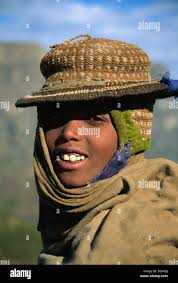 Smiling hill tribe boy with hand woven hat Simien Mountains Ethiopia Africa  Stock Photo