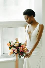 Tangerine oranges, and juicy apricot corals make a splash in this stunning spring wedding flower centerpiece. 2021 And 2022 Wedding Trends Winnipeg Wedding Florist Stone House Creative