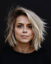 For this style, short wavy hair with a few layers is curled, and then messed up with texture spray and paste on the ends to thicken up the look. V E R S A T I L I T Y Medium Length Hair Styles Medium Hair Styles Medium Short Haircuts