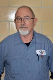 Head custodian Mike Endicott. A hero is someone who is admired or idealized for courage, outstanding achievements, or noble qualities. - Janitors-2513-001-200x300
