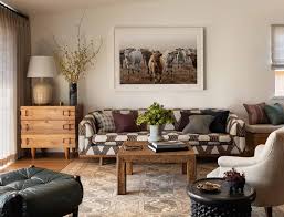 Now that's a house we want to live in. Heidi Caillier Design Seattle Interior Designer Olympic Manor House Modern Traditional Great Room Printed Sofa Turkish Rug Cow Art White Paint Heidi Caillier