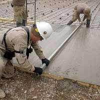 US Navy 110331-N-SN160-035 Steelworker 3rd Class Caleb Baker and Equipment  Operator Constructionman Eric Hofmans take a hydration break during the
