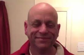 Dr. David Sundy helps patient with numbness in his hands.