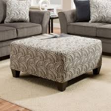 The unique contemporary design of the accara accent table collection features the stylish look of the rich faux leather upholstered ottoman with nesting storage cubes that feature a medium brown finish. Umber Kiara 6485 097 Cocktail Ottoman With Tapered Legs Efo Furniture Outlet Ottomans