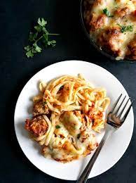 Overhead View Of A White Plate Of Baked Spaghetti And Meatballs With A F Baked Spaghetti And Meatballs Baked Spaghetti Squash Recipes Spaghetti Squash Recipes