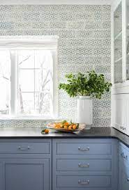 Black cabinets are a great way to frame a beautiful counter. Rich Blue Cabinets Light Blue Kitchen Wallpaper In The Kitchen Black Granite Counter Light Blue Kitchens Black Kitchen Countertops Blue Kitchen Wallpaper