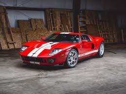 2006 Ford Gt 550 Hp 5 4 Litre Supercharged V 8 Engine Ricardo Six Speed Manual Transmission 205 Mph In Mark Iv Red With White Racin Ford Gt Car Stripes Ford