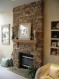 This idea is basically still the same as the previous ones. Interior Classy Living Room Design Ideas With Brown Stone Electric Fireplace And Wooden Wall Mounte Stone Fireplace Designs Fireplace Design Rock Fireplaces