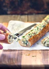 This Easy Cheesy Creamy Feta And Spinach Stuffed French Bread Is Deliriously Rich And Tasty It Reminds Me Of A Greek Spanakopi Yummy Appetizers Food Recipes