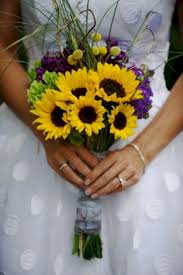Here, we're showcasing some of our favorite sunflower wedding bouquets, perfect for any type of bride and the pros mixed both large and small sunflowers with sizable dahlias and tiny blue and purple buds. Purple And Yellow Sunflower Wedding Bouquet Oosile