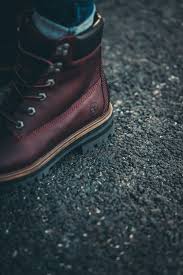 These boots can be worn with various outfits and are great for keeping your feet warm and comfortable throughout the day. A Pair Of Brown Timberland Boots Photo Free Timberland Image On Unsplash