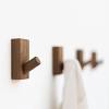 Made from wood and steel piping, these fixtured rows would look a sparrow wall hooks: 1