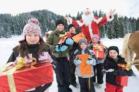 Italy, South Tyrol, Seiseralm, Santa Claus and children taking a sleigh  ride stock photo