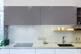 Nowadays, open plan kitchen living room layouts becoming more and more popular and designed for a reason. Modern Home Interior Modern Kitchen Design In Light Interior There Is Also A Kitchen Island In The Room Kitchen And Living Room Combined European Furniture Design Technologies Front View Stock Photo Picture