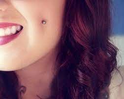 pin on cheek dimple piercings