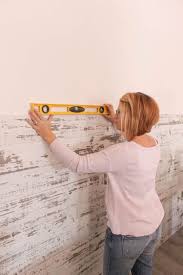 A wood plank wall can add a rustic focal point to a room. How To Install A Wood Plank Wall