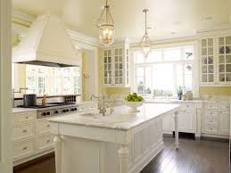 If you want to paint your bedroom but you don't want a shockingly bright color, go with pale yellow walls. White And Yellow Kitchen Traditional Kitchen Sullivan Conard Architects