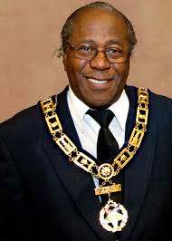 I wonder if anyone could adjust this picture of my Grandson. He is going to  be 15 soon & I would like to give him a framed picture of this photograph  for