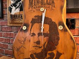 Finished this one today , all drawn and burnt into the wood by hand , I  then add a real guitar neck, insert brass shotgun shells, wax finish the  wood, and finally