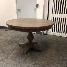 We see a expandable round table with a vertical frame ramified in four legs. Restoration Hardware 17th C Priory Table Chairish