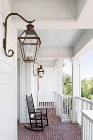 When choosing a porch ceiling color, most people probably would select a light blue. Wraparound Porch With Red Brick Pavers Transitional Porch