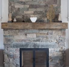 Reclaimed white oak mantel with custom cut dovetails. Longleaf Lumber Reclaimed Wood Fireplace Mantels