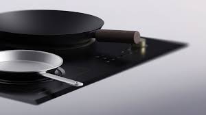 Will induction cooktop work with cast iron? Amphi Portable Induction Cooktop Changes Shape To Fit Woks