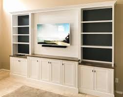 White Entertainment Center With Shiplap Upper And Painted Shelf Backing White Entertainment Center Living Room Built Ins Living Room Entertainment