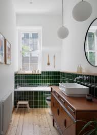 In The Main Bathroom Surfaces Have Been Updated With Glazed Green Tiles Which Clad The Lower Hal Bay Window Living Room Green Tile Bathroom Apartment Interior