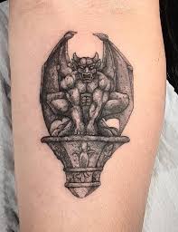 Gargoyle tattoos were carved in black colour highlighting it's eyes to lend a scary look so that the wicked or sinful elements is thrown away from the body and protect it from any evil spirits. Gargoyle Tattoos Explained Meanings Tattoo Designs More