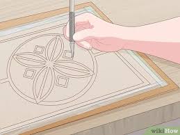 Next, the tracing paper went over the leather, with some weights on the corners. How To Carve Leather With Pictures Wikihow