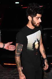 Zayn had the tattoo of perrie done at the tattooed heart studio in maryland, where he was joined by louis tomlinson, back in june 2013. Zayn Shows What He Covered His Perrie Edwards Tattoo With On Date Night With Gigi Hadid Girlfriend