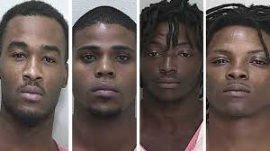 4 charged with beating man, stealing clothing