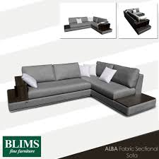 Simple Contemporary Functional This Fabric Sectional Sofa Features A Built In Wooden Side Table Couches Living Room Fabric Sectional Sofas Wooden Side Table
