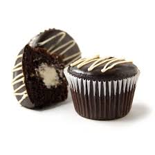 In a small saucepan, bring cream just to a boil. Cream Filled Cupcake Sweets From The Earth