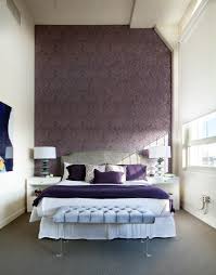 In a living room or a bedroom, adding a dark purple feature wall with complementary art and spotlights creates a stunning look. Purple Accent Wall Houzz