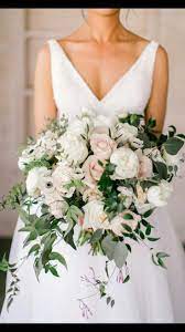 Winter wedding bouquets bride white and light pink flowers. You Can Call Your Floral Designer Up To A Year Beforehand But You Normally Won T Need To Meet Wedding Bouquets Pink Blush Wedding Flowers Blush Pink Bouquets
