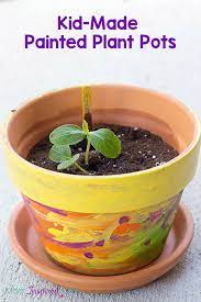 You'll love to display your plants in these diy pots! Kid Made Painted Planter Or Flower Pot