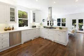 Many of us automatically go for contrasts when we're remodeling a kitchen, so choosing a laminate floor that's a good deal darker than your oak cabinets is a popular choice. Light Or Dark Flooring Everything You Should Consider When Choosing New York Carpets Flooring